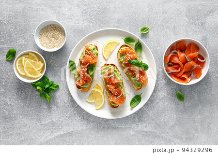 Toasts with salted salmon and avocado guacamole, top view Toasts with salted salmon and avocado guacamole, top view 94329296