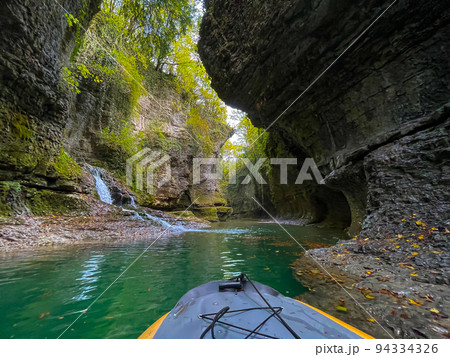 POV riding boat on calm mountain river POV riding boat on calm mountain river 94334326