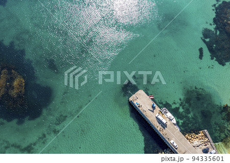 Aerial view of the pier at Leabgarrow on Arranmore Island in County Donegal, Republic of Ireland 94335601