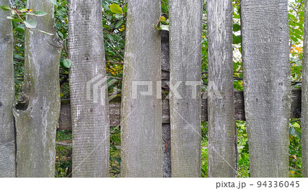 Weathered curved board fence Weathered curved board fence 94336045