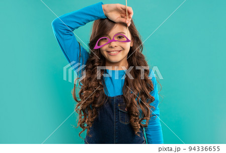 cheerful funny child with glasses. teen party-goer. party time. birthday holiday celebration cheerful funny child with glasses. teen party-goer. party time. birthday holiday celebration 94336655