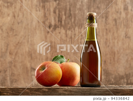 Apple vinegar cider with apple fruit on old wooden background. 94336842