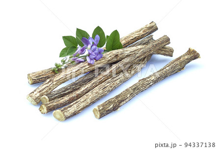Licorice dry roots with flowers on white background 94337138