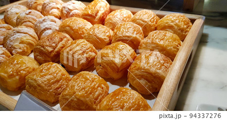 Assorted fresh baked sweet puff pastry stuffed with fruit and jelly and danish chocolate fill pastry, super delicious warm fresh buttery French and American baked pastries are enjoyed world wide on ba Assorted fresh baked sweet puff pastry stuffed with fruit and jelly and danish chocolate fill pastry, super delicious warm fresh buttery French and American baked pastries are enjoyed world wide on ba 94337276