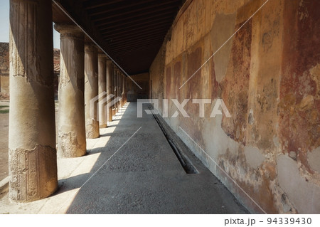 Large pillars at ancient corridor angle shot 94339430