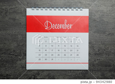 December calendar on grey stone background, top view December calendar on grey stone background, top view 94342980