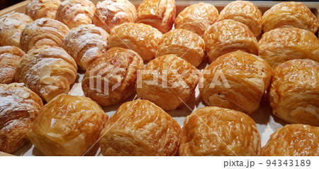 Assorted fresh baked sweet puff pastry stuffed with fruit and jelly and danish chocolate fill pastry, super delicious warm fresh buttery French and American baked pastries are enjoyed world wide on ba 94343189