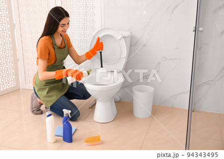 Young female cleaner Stock Photo by ©belchonock 152147058