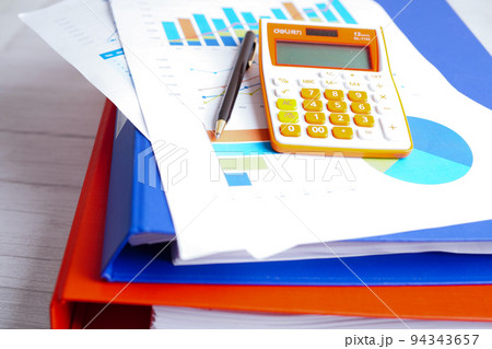 Calculator on chart and graph spreadsheet paper. Finance development, Banking Account, Statistics, Investment Analytic research data economy, Stock exchange trading, Business company concept. Calculator on chart and graph spreadsheet paper. Finance development, Banking Account, Statistics, Investment Analytic research data economy, Stock exchange trading, Business company concept. 94343657