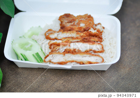 rice topped with chicken or chicken rice or fried chicken and rice in the box rice topped with chicken or chicken rice or fried chicken and rice in the box 94343971