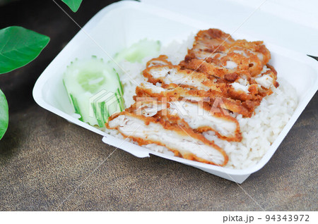 rice topped with chicken or chicken rice or fried chicken and rice in the box rice topped with chicken or chicken rice or fried chicken and rice in the box 94343972