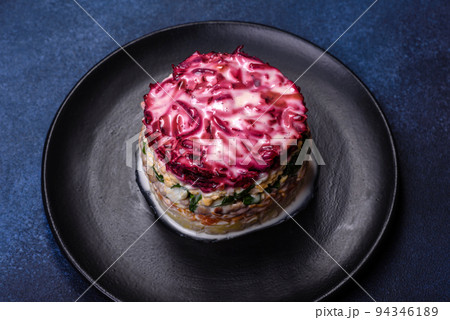 Traditional Ukrainian multilayered salad from herring, beets, potatoes, carrots and eggs Traditional Ukrainian multilayered salad from herring, beets, potatoes, carrots and eggs 94346189
