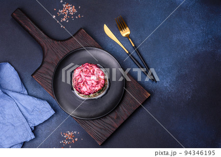 Traditional Ukrainian multilayered salad from herring, beets, potatoes, carrots and eggs Traditional Ukrainian multilayered salad from herring, beets, potatoes, carrots and eggs 94346195