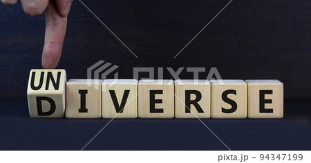 Diverse or universe symbol. Turned wooden cubes and changed the concept word Universe to Diverse. Beautiful grey table grey background. Copy space. Business and universe or diverse concept. Diverse or universe symbol. Turned wooden cubes and changed the concept word Universe to Diverse. Beautiful grey table grey background. Copy space. Business and universe or diverse concept. 94347199