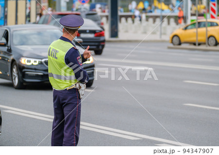Traffic officer standing near road Traffic officer standing near road 94347907
