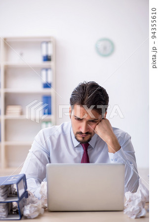 Young male employee in rejected ideas concept Young male employee in rejected ideas concept 94355610