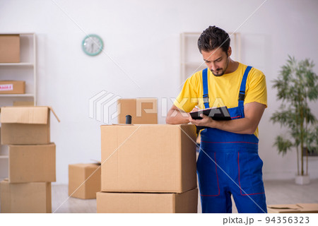 Young male contractor doing home relocation Young male contractor doing home relocation 94356323