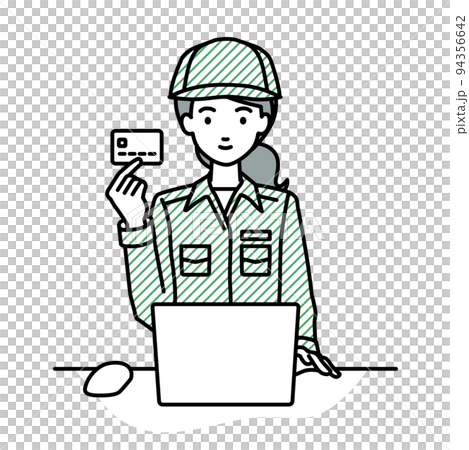 A female worker sitting at a desk and using a PC while holding a credit card A female worker sitting at a desk and using a PC while holding a credit card 94356642