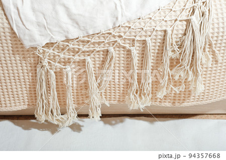 natural cotton house textile with woven macrame fringes. eco scandinavian style home design. boho bedding and decorative fabric natural cotton house textile with woven macrame fringes. eco scandinavian style home design. boho bedding and decorative fabric 94357668