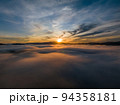 Aerial view drone flying over sea of fog at sunrise, Khoa Khai nui mountain, Phang Nga, Thailand. 94358181
