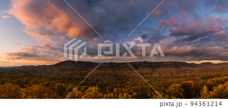 Autumn landscape at sunset, hills of Bohemian Switzerland and Saxon Switzerland National Park, Czech Republic, Germany 94361214
