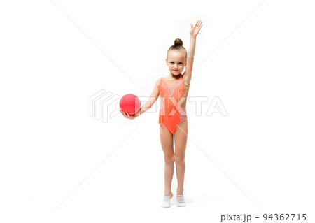 Small artistic gymnast girl with rubber ball 94362715