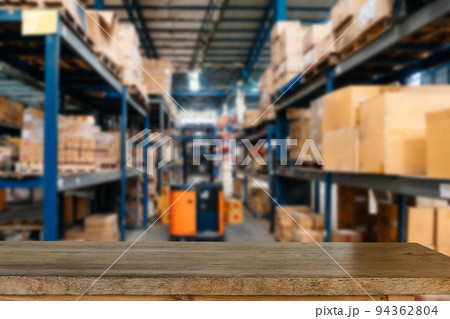 Empty top of wooden shelves on warehouse template background for product display. Empty top of wooden shelves on warehouse template background for product display. 94362804