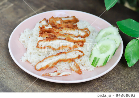 rice topped with chicken or chicken rice or fried chicken and rice rice topped with chicken or chicken rice or fried chicken and rice 94368692