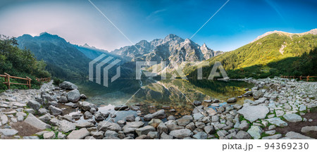 Tatra National Park, Poland. Panorama Famous Mountains Lake Morskie Oko Or Sea Eye Lake In Summer Morning. Five Lakes Valley. Beautiful Scenic Viev 94369230