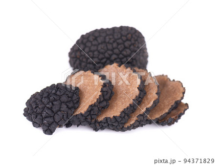 Black truffles isolated on a white background. Fresh sliced truffle. Delicacy exclusive truffle mushroom. Piquant and fragrant French delicacy. Clipping path. 94371829