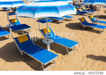 Traditional beach chair and umbrella. Rimini, Italy, Traditional beach chair and umbrella. Rimini, Italy, 94372588