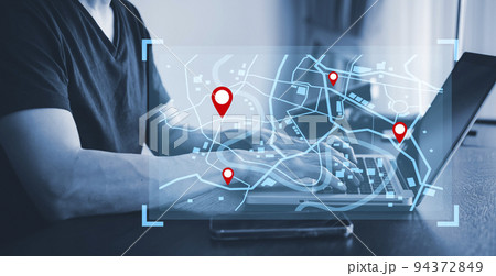Man using laptop with virtual world and model map with location point , GPS app, icon Travel maps and find places in the online system, all screen graphics are generated,Searching for travel. 94372849