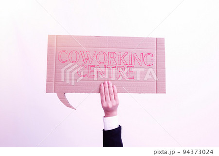 Hand writing sign Coworking Centreshared workplace often office and independent activity. Word Written on shared workplace often office and independent activity Hand writing sign Coworking Centreshared workplace often office and independent activity. Word Written on shared workplace often office and independent activity 94373024