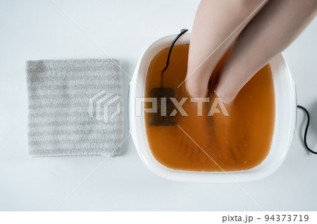 procedure of ionic detox foot bath machine in spa beauty center isolated procedure of ionic detox foot bath machine in spa beauty center isolated 94373719