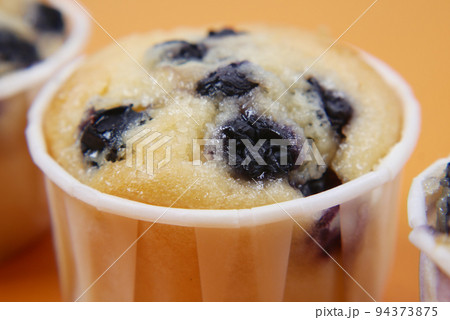 close up of chocolate muffin on table  94373875