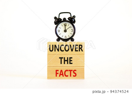 Uncover the facts symbol. Concept words Uncover the facts on wooden blocks on a beautiful white table white background. Black alarm clock. Business and uncover the facts concept. Copy space. Uncover the facts symbol. Concept words Uncover the facts on wooden blocks on a beautiful white table white background. Black alarm clock. Business and uncover the facts concept. Copy space. 94374524