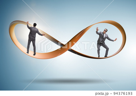 Businessman running on the endless loop 94376193