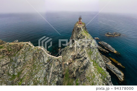 An old ruined lighthouse on Askold Island in the East Sea An old ruined lighthouse on Askold Island in the East Sea 94378000