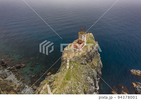 An old ruined lighthouse on Askold Island in the East Sea An old ruined lighthouse on Askold Island in the East Sea 94378001