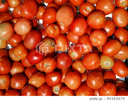 group of sticking raw organic Tomatoes of different, Fresh juicy appetizing tomatoes. Raf tomato, cherry in opened fresh market, Macro Photo spring food  94383074