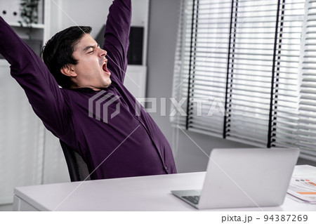 The exhausted asian office worker who was once competent is now confused The exhausted asian office worker who was once competent is now confused 94387269