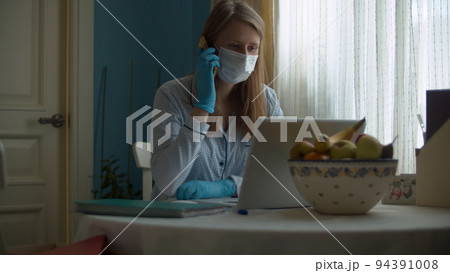 Portrait of woman working from home Portrait of woman working from home 94391008