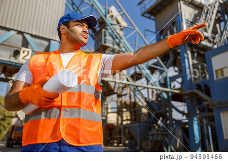 African male engineer inspecting site at construction plant African male engineer inspecting site at construction plant 94393466