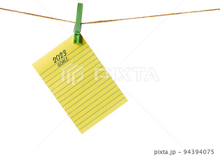 New Year New Goals. Yellow Sticky Note Paper on a clothesline isolated on white. To do list New Year New Goals. Yellow Sticky Note Paper on a clothesline isolated on white. To do list 94394075