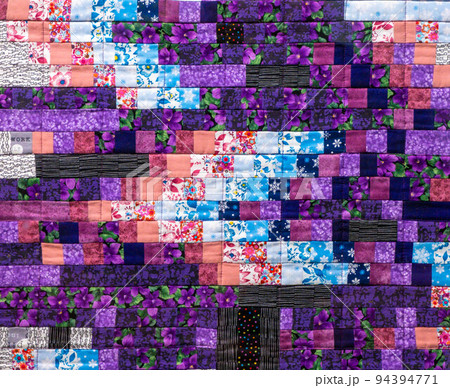 Patchwork quilt. Part of patchwork quilt as background. Flower print. Color blanket in style patchwork. Color blanket. Handmade Patchwork quilt. Part of patchwork quilt as background. Flower print. Color blanket in style patchwork. Color blanket. Handmade 94394771