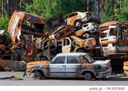 Skeletons of burned cars piled up after the expulsion of Russian invaders near the city of Irpen near Kyiv. Skeletons of burned cars piled up after the expulsion of Russian invaders near the city of Irpen near Kyiv. 94395980