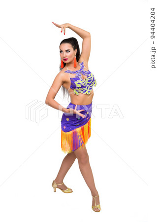 A young female dancer in a bright costume shows hand movements on a white background A young female dancer in a bright costume shows hand movements on a white background 94404204