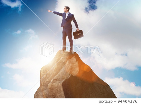Businessman at the top of mountain Businessman at the top of mountain 94404376