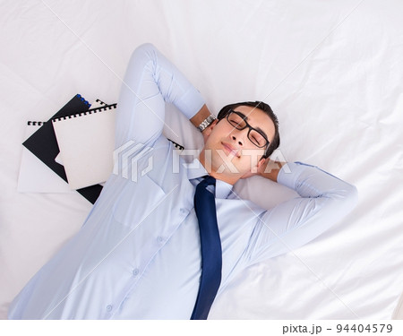 Businessman working in hotel room Businessman working in hotel room 94404579
