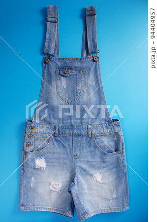 Blue jeans overall denim on blue background Blue jeans overall denim on blue background 94404957